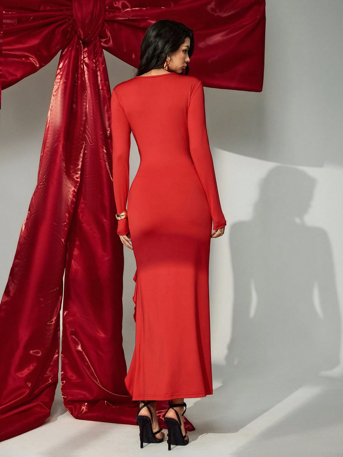 Elevate your seasonal wardrobe with this stunning dress that effortlessly blends sophistication and sass. The flattering V-neckline draws attention upward, while delicate ruffle trim adds a playful touch of texture and movement. Long sleeves provide versatile coverage for cooler days, and the high slit brings just the right amount of flirtation to your stride. Whether you're dressing up for brunch or heading out for an evening adventure, this piece transitions seamlessly from spring florals to autumn layers