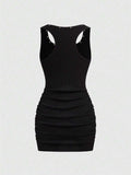 Close-up of scoop neck ruched mini dress for casual concert looks