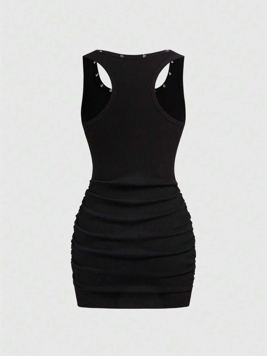 Close-up of scoop neck ruched mini dress for casual concert looks