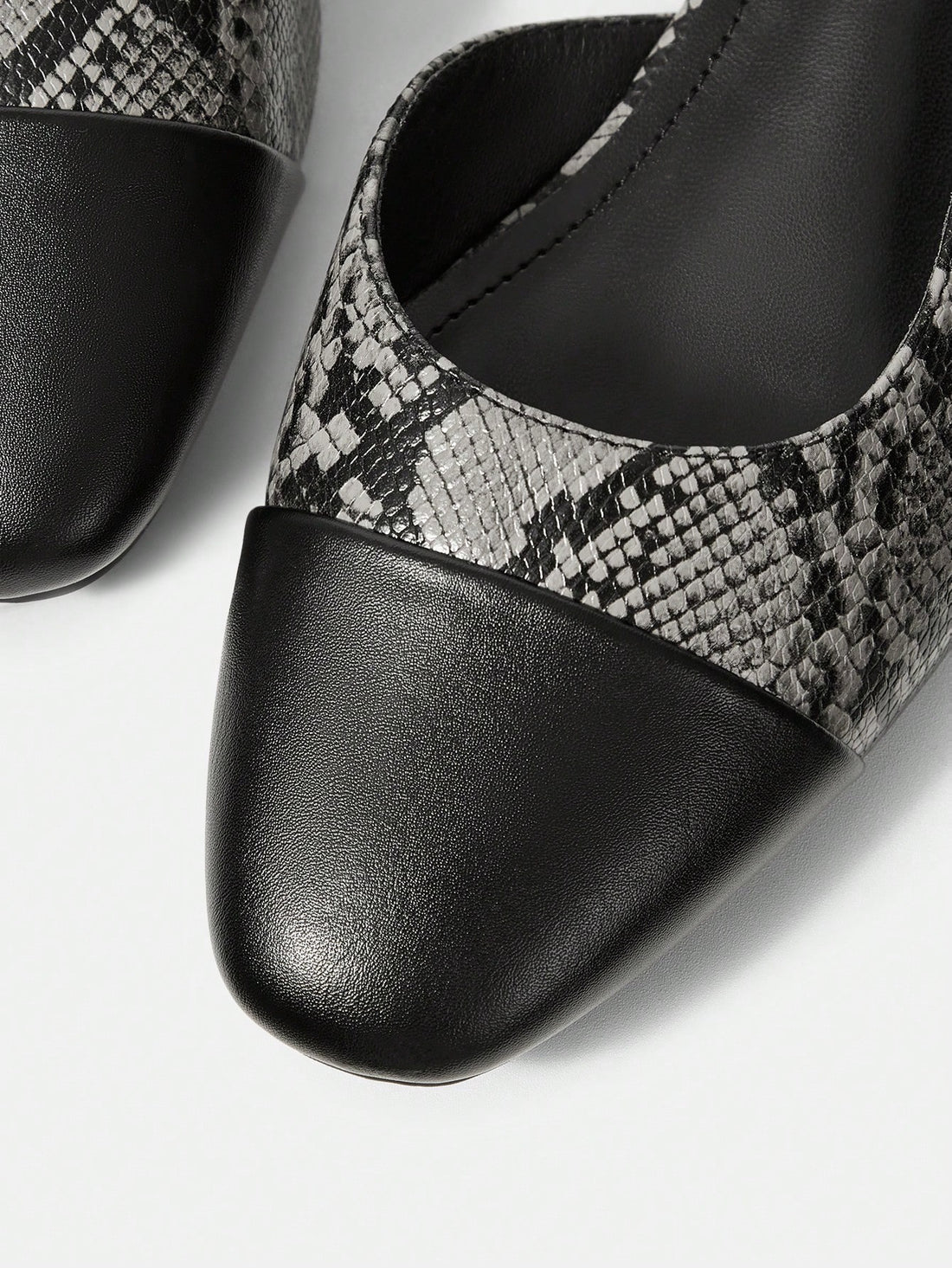 Effortlessly transition from office to evening with these versatile slip-on flats. Designed with a subtle low heel for gentle arch support and all-day comfort, they deliver polished sophistication without sacrificing wearability. The streamlined silhouette pairs seamlessly with professional attire, casual wear, or dressed-up looks. Premium construction ensures durability through countless occasions, while the slip-on design eliminates fumbling with laces or buckles. A refined choice for the discerning woman