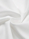 Close-up of white matte knit T-shirt fabric with soft folds and fine texture