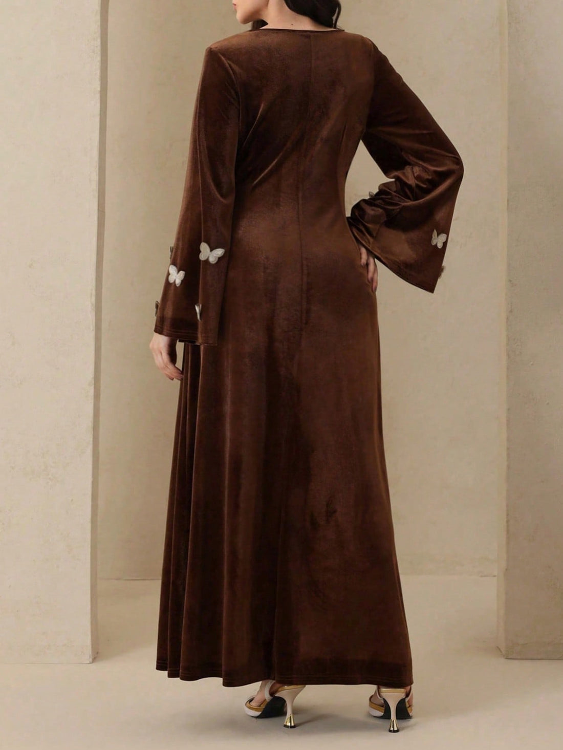 Slip into pure elegance with this stunning velvet long sleeve dress that's ready to turn heads! The luxurious velvet fabric drapes beautifully while the cinched waist creates a flattering silhouette that celebrates your curves. Delicate butterfly embellishments add a whimsical touch of magic to the design, making this dress perfect for special occasions, date nights, or whenever you want to feel absolutely fabulous. Long sleeves provide graceful coverage while maintaining that sophisticated vibe. Whether yo