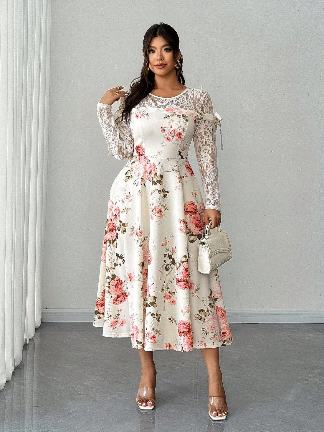 Celebrate your curves in this stunning plus-size dress that's equal parts sophisticated and fun! Featuring delicate lace patchwork combined with vibrant floral details, this showstopper is designed to make you feel fabulous at weddings, parties, and special events. The thoughtful mix of textures creates visual interest while the flattering silhouette ensures you'll turn heads for all the right reasons. Perfect for anyone who refuses to compromise on style or comfort—because looking amazing shouldn't mean sa