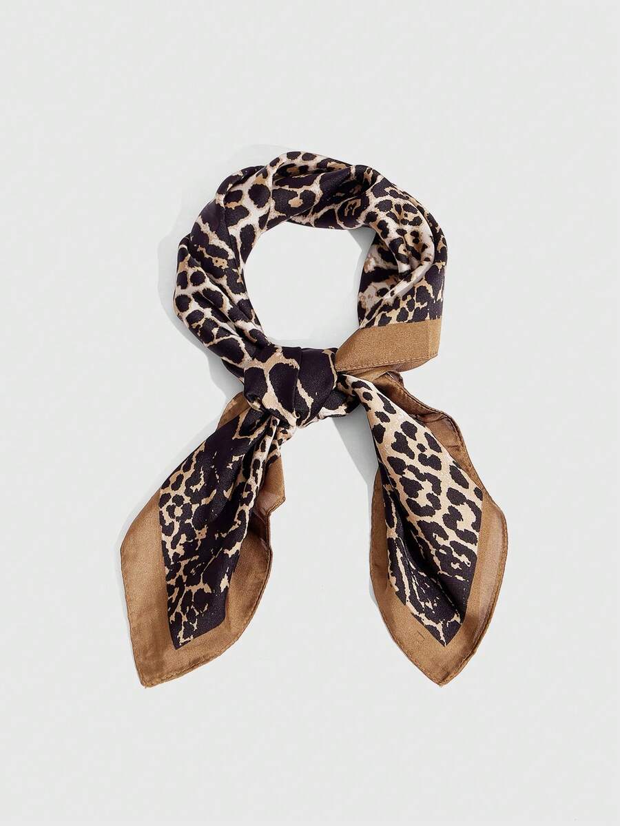 Elevate your accessory collection with this luxurious leopard print silk scarf. Crafted from premium silk, it drapes beautifully around the neck, shoulders, or hair, offering timeless sophistication with a bold animal print edge. The versatile design transitions seamlessly from casual daywear to evening elegance. Perfect for adding a touch of glamour to any outfit, this scarf combines classic style with modern flair. A must-have piece for women who appreciate quality fabrics and statement accessories.