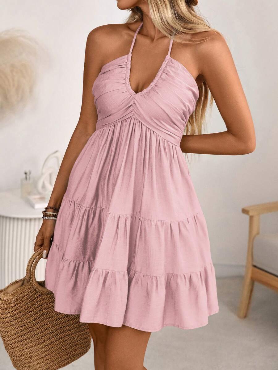 Embrace effortless coastal elegance with this bohemian beach dress, crafted from breathable linen for warm-weather comfort. The backless design features a striking bamboo knot detail, while the tiered A-line silhouette flatters every figure. Perfect for spring and summer getaways, this vacation essential transitions seamlessly from beach days to sunset dinners. Lightweight, flowing, and undeniably chic—your new go-to piece for carefree style.