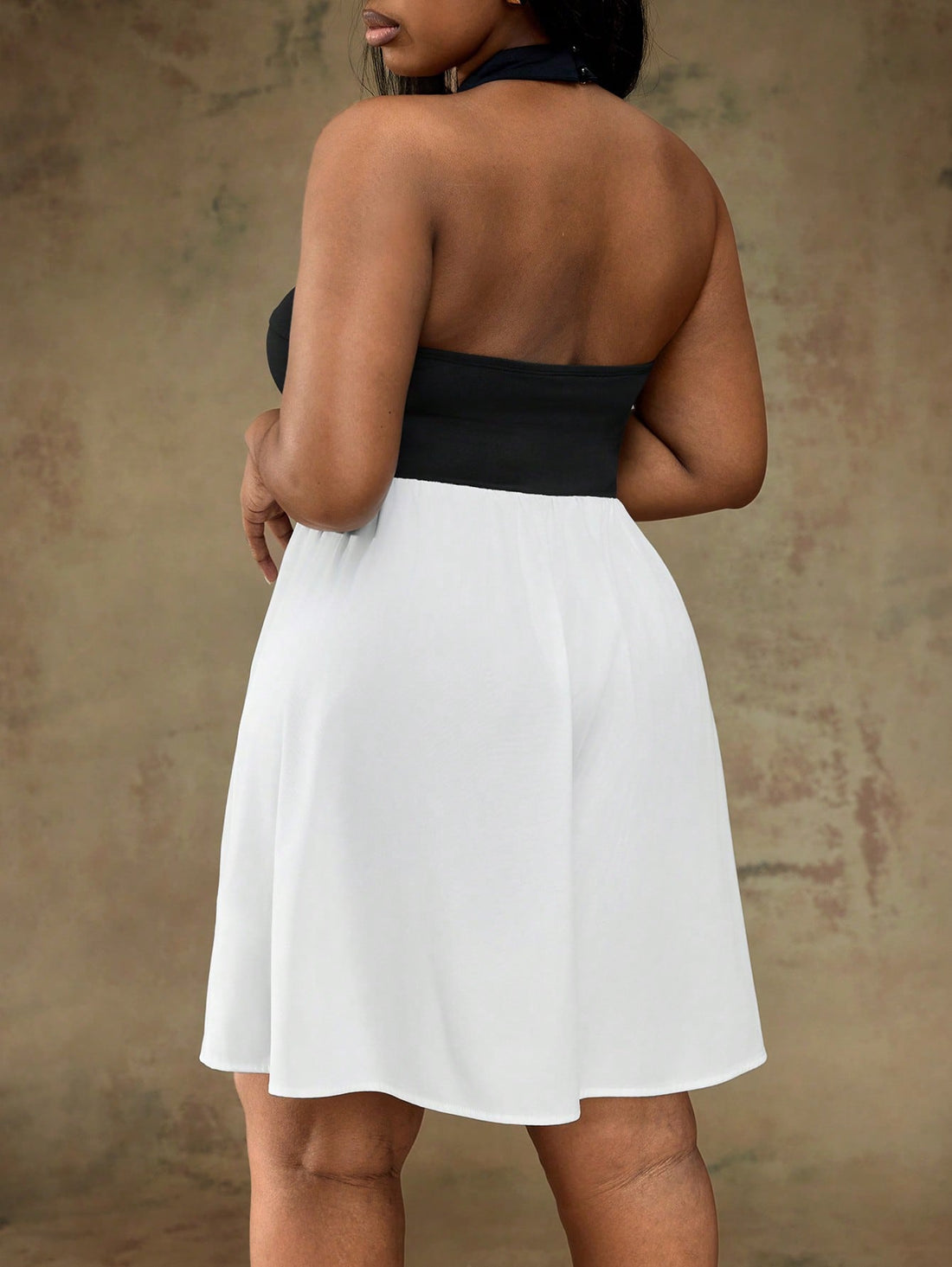 Make a statement in this stunning plus-size dress that effortlessly blends bold style with flattering silhouettes. The off-shoulder neckline adds a touch of elegance, while the black and white patchwork design keeps things visually exciting. An A-line cut skims your curves beautifully, and the playful ruffle waist detail brings movement and personality to every step. Perfect for date nights, parties, or any occasion where you want to feel confident and fabulous. Dress up with heels or keep it casual—this ve