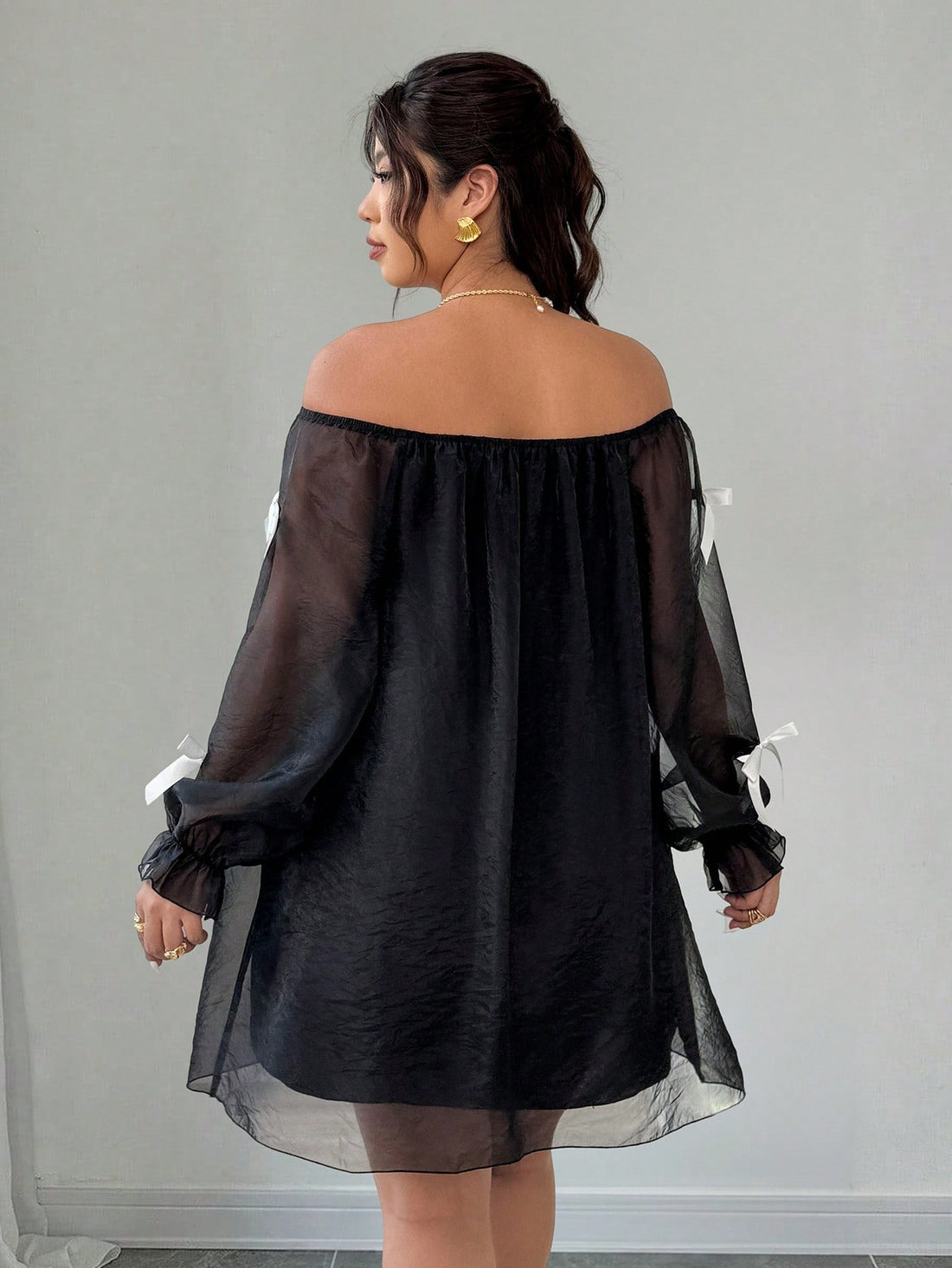 Turn heads this season in a dress designed to make you feel fabulous! This plus-size beauty features a flirty off-shoulder neckline with an adorable bow tie accent that brings instant charm to any outfit. The breathable mesh construction keeps you cool and comfortable, while the A-line cut flatters your figure beautifully. Whether you're heading to brunch, a romantic date night, or jetting off on vacation, this versatile piece handles it all with playful sophistication. From casual commutes to special occas