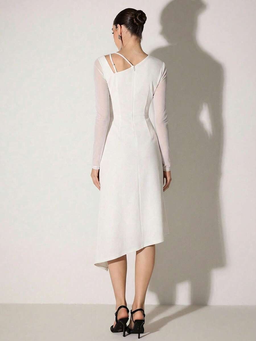 This sophisticated white cocktail dress features an asymmetric cold shoulder design that balances elegance with contemporary flair. The draped neckline creates a flattering silhouette while the off-shoulder cut adds modern appeal perfect for evening events, cocktail parties, or upscale gatherings. The clean white palette ensures versatility, pairing effortlessly with statement jewelry and heels. Crafted for refined occasions, this dress delivers polished style with an unexpected design twist that sets it ap