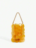 Amber orange shell disc mini handbag with gold bead wrist handle