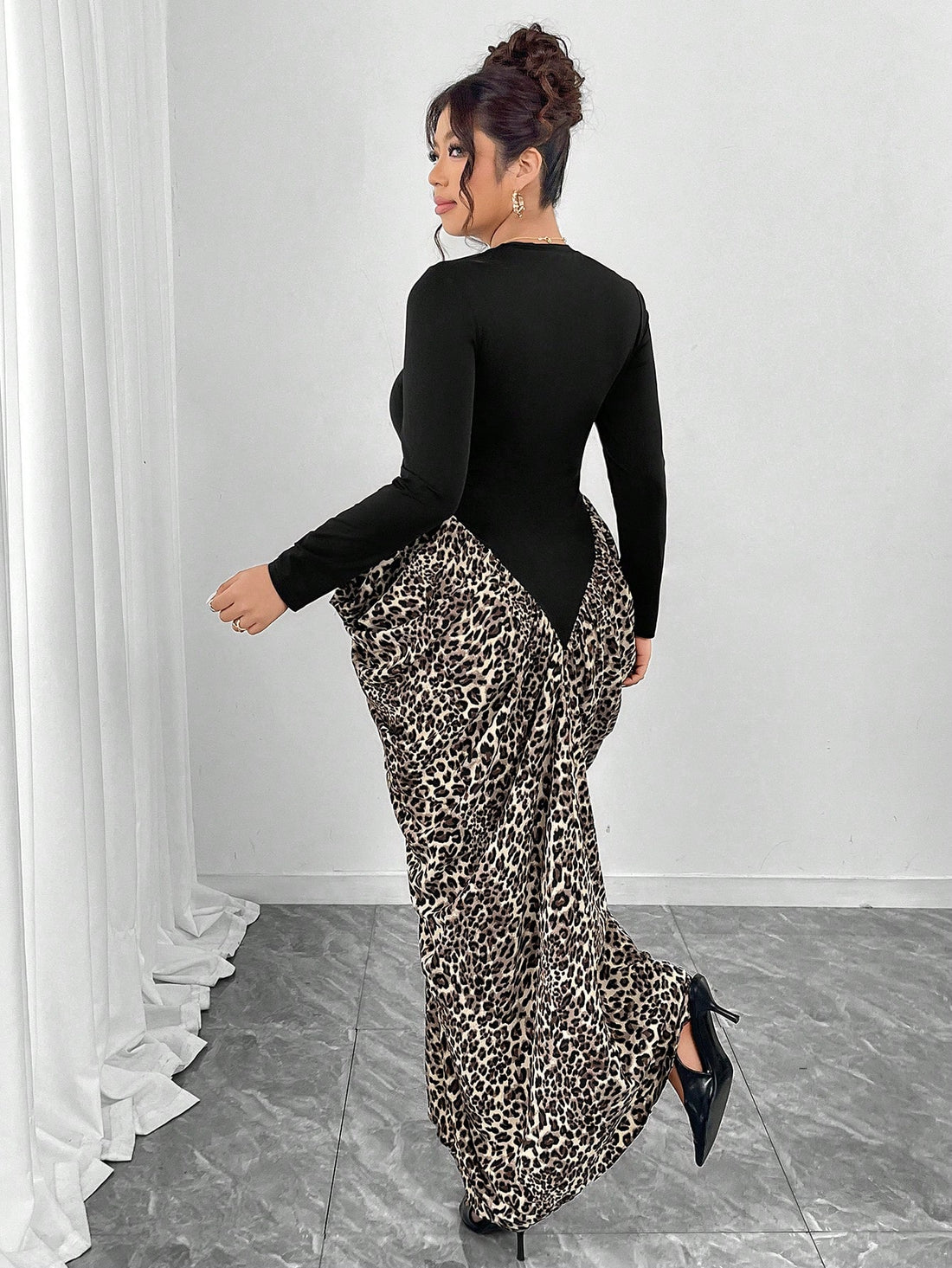 Make a statement in this stunning leopard print fishtail dress that celebrates your curves with confidence and flair. The high neckline and long sleeves offer sophisticated coverage, while the dramatic fishtail hem adds a touch of glamour perfect for weddings, galas, or any special occasion. Crafted for plus-size figures, this dress combines bold animal print with elegant silhouette for a look that's undeniably fierce and fabulous. Turn heads and own the room in style.