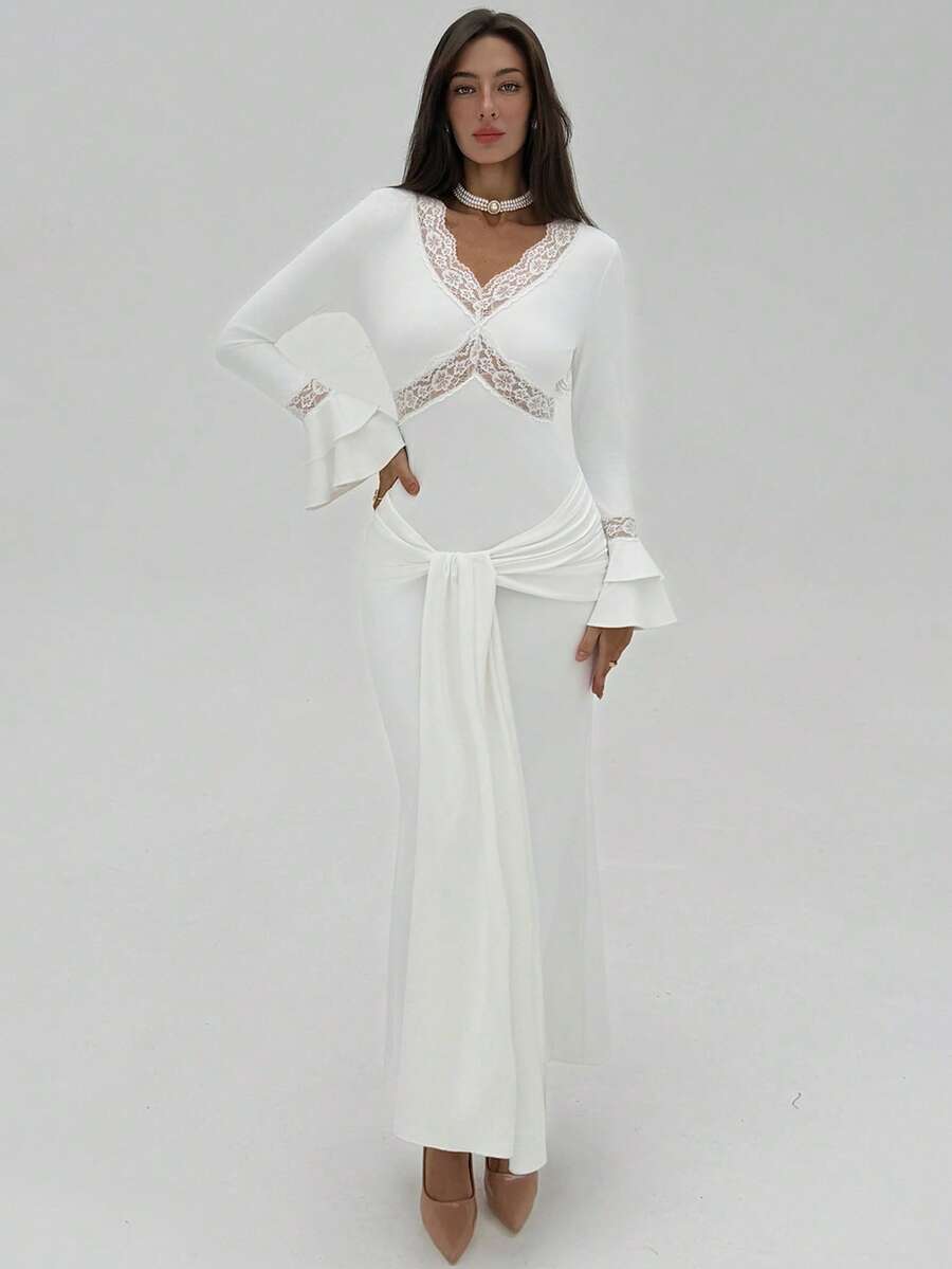 Experience the breathtaking fusion of bridal heritage and sharp, modern architectural tailoring. This stunning deep V-neck ensemble is meticulously designed for the woman who values a high-fashion, "quiet luxury" approach to ceremonial dressing—the ultimate centerpiece for prestigious wedding retreats, exclusive gala soirées, and high-authority special occasions.