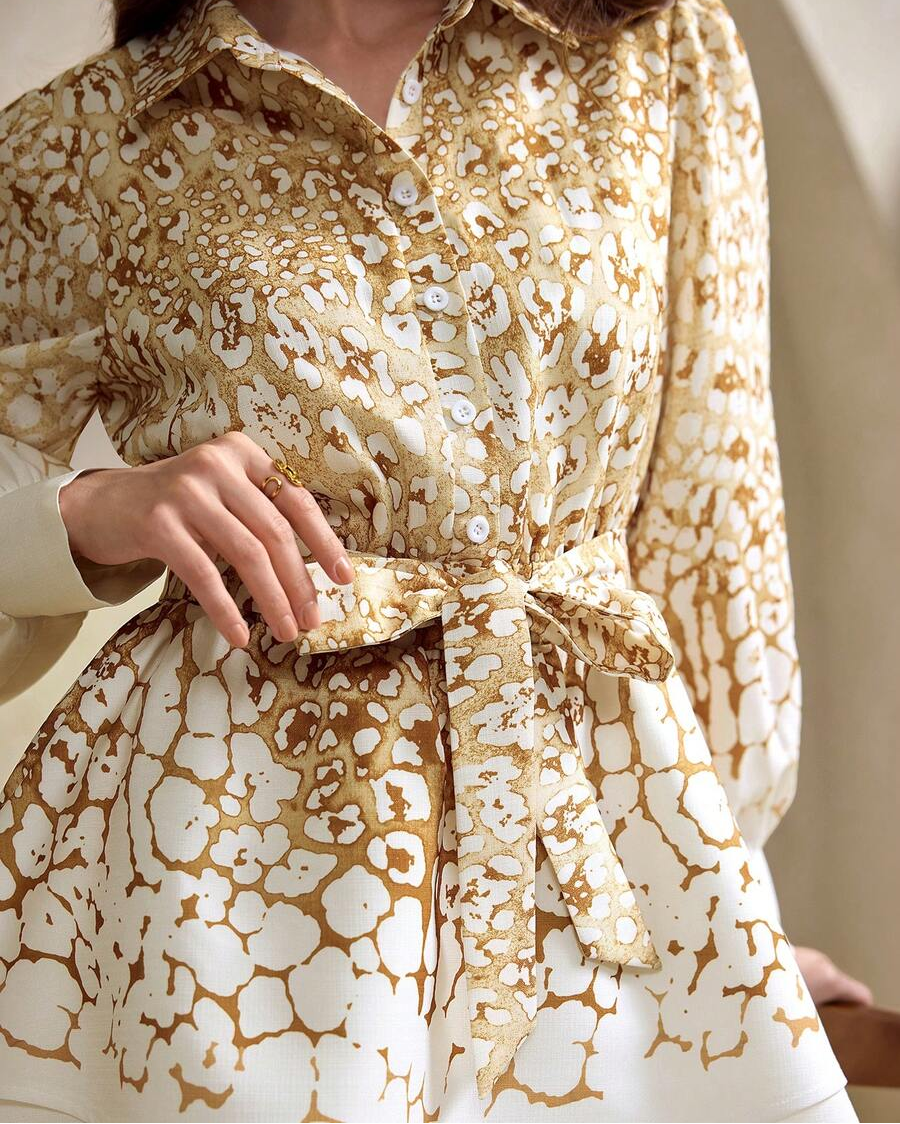 Elevate your autumn wardrobe with this show-stopping leopard ombre shirtdress that blends wild style with effortless sophistication. The tie-front detail cinches your silhouette for a flattering fit, while the playful bubble skirt adds movement and personality to every step. Perfect for transitioning from casual days to special occasions, this versatile piece pairs beautifully with sneakers or heels. The ombre leopard print brings just the right amount of edge without compromising on elegance—because who sa