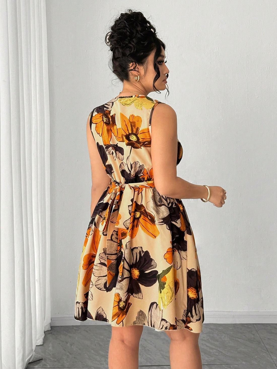 Twirl into spring with this show-stopping tie-dye floral midi dress that celebrates curves with effortless style. The sleeveless silhouette keeps things breezy while the pleated waist cinches beautifully, creating a flattering shape that moves with you. Vibrant watercolor florals meet dreamy tie-dye patterns for a look that's equal parts whimsical and sophisticated. Perfect for garden parties, weekend brunches, or whenever you want to feel absolutely fabulous. This plus-size beauty proves that comfort and e