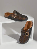 Smoky black translucent woven clog mules with gold buckles and black lug soles