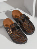 Top view of smoky black woven clogs with cork-look footbeds