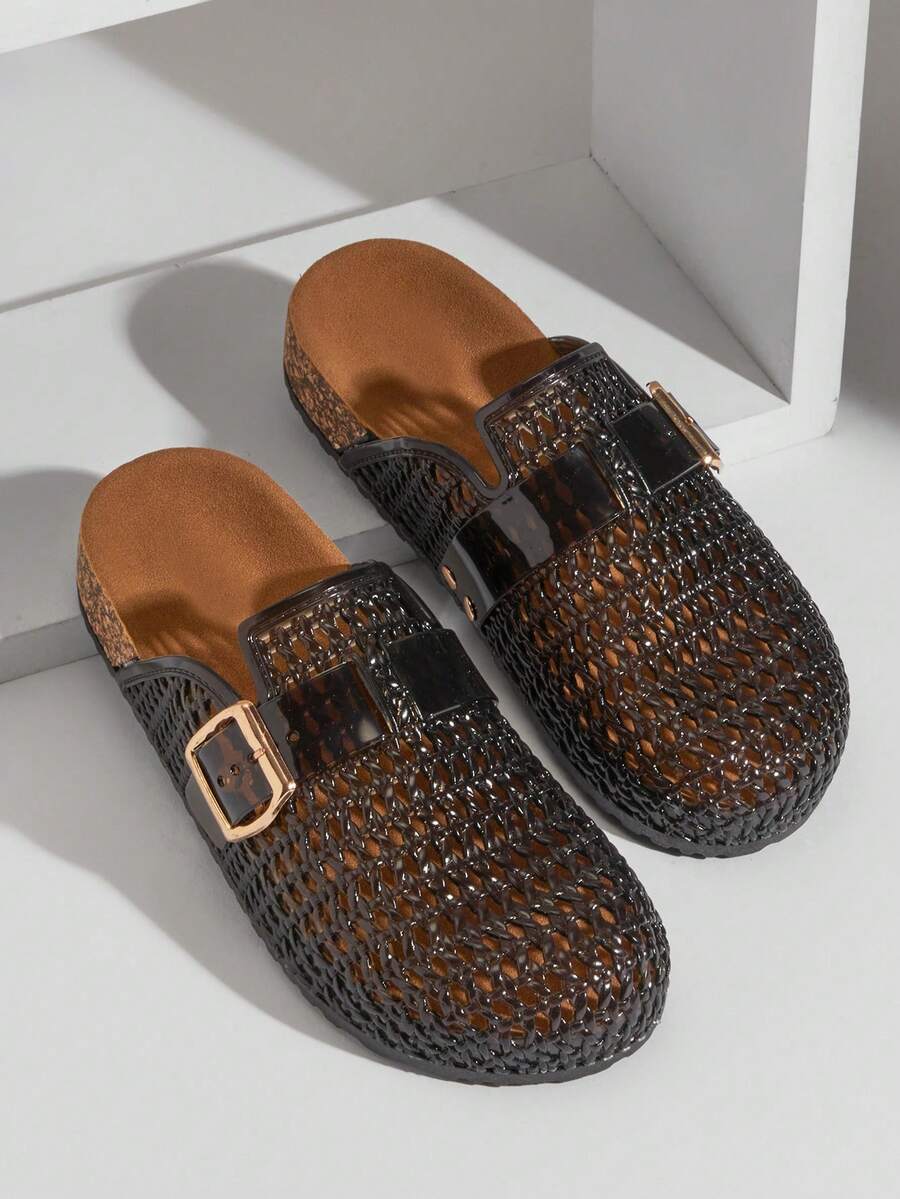 Top view of smoky black woven clogs with cork-look footbeds