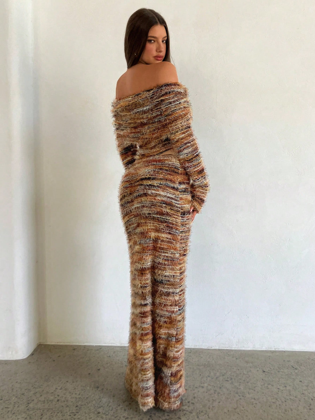 Make a bold statement with this vibrant two-piece set that's all about fun and flair! The off-shoulder long sleeve top features eye-catching colorful yarn details that add texture and personality, while the coordinating skirt completes the look with effortless style. Perfect for turning heads at casual outings, weekend hangouts, or whenever you want to feel confident and colorful. Mix, match, or wear together—this set gives you endless styling possibilities that celebrate your unique vibe.