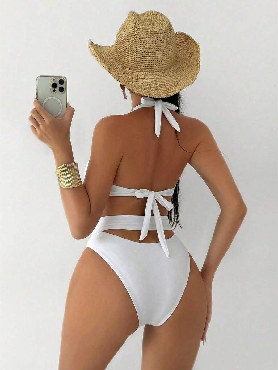 Make a statement at the pool or beach with this sophisticated one-piece swimsuit designed for confidence and style. The solid construction offers timeless elegance, while thick supportive straps and a striking crisscross back detail provide both comfort and visual interest. Gold accents add a touch of luxury to this flattering silhouette. Perfect for swimmers who want coverage without compromising on fashion-forward design.