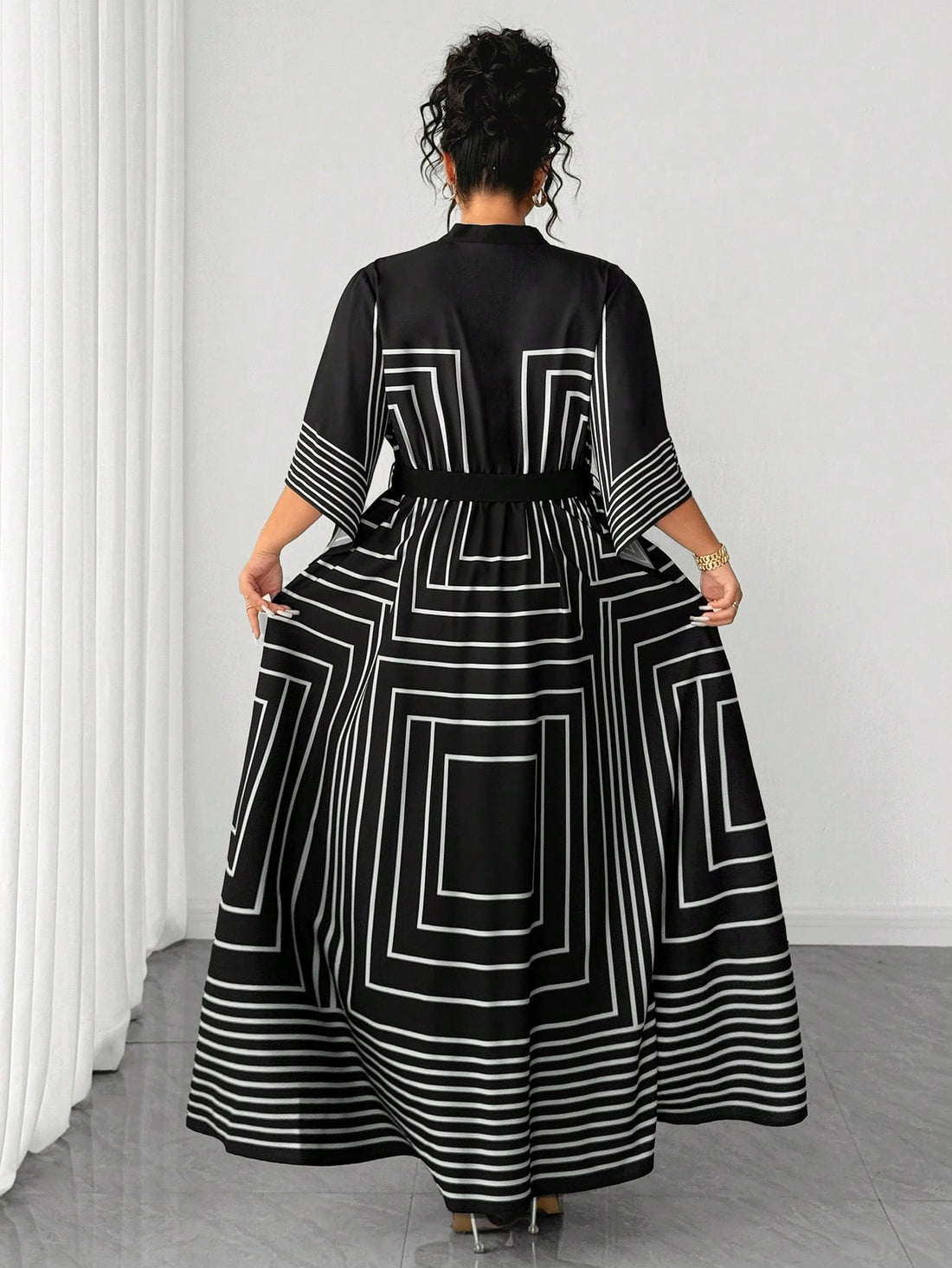 Stripes never looked so chic! This plus-size A-line dress combines timeless geometric black and white patterns with a crisp collared neckline for an effortlessly polished look. The flattering A-line silhouette skims beautifully over curves while the classic stripe design adds visual interest and movement. Perfect for dressing up or down, this versatile piece transitions seamlessly from office to weekend brunch. Comfortable, stylish, and undeniably fabulous—because looking good should always feel this easy.