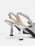 side and heel view of silver glitter slingback stiletto pump