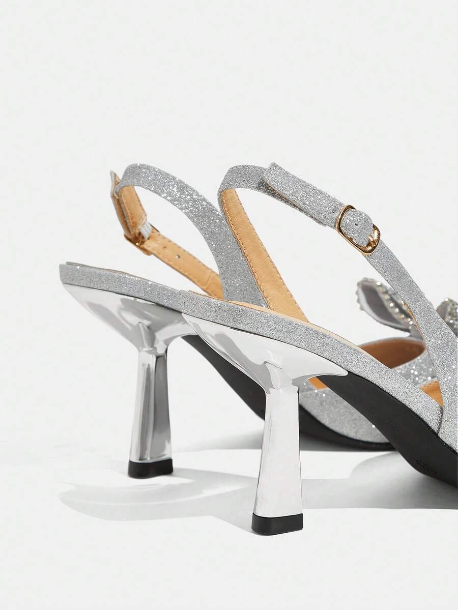 side and heel view of silver glitter slingback stiletto pump