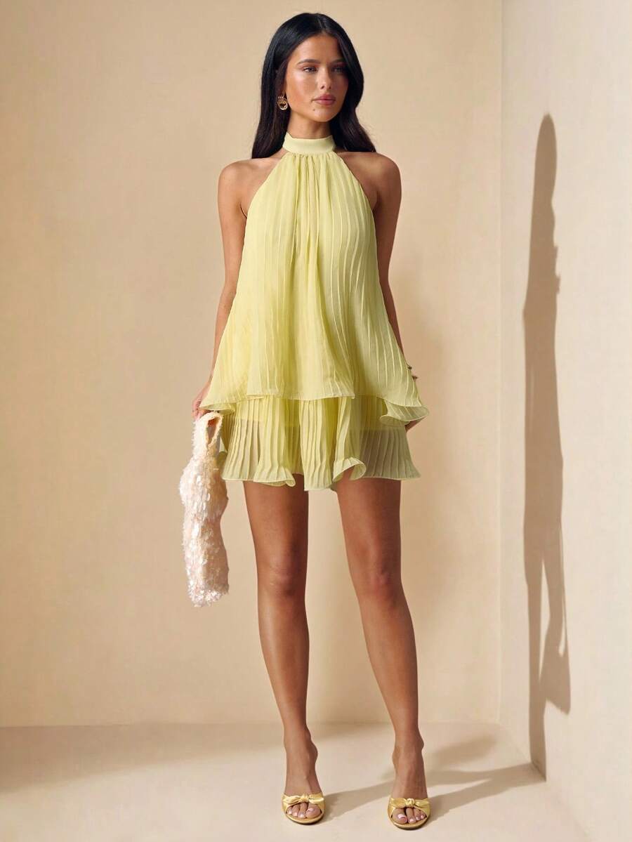 Elevate your wardrobe with this stunning light yellow sleeveless dress, designed for effortless elegance. Featuring a flattering halter neckline with ruched detailing and a flared A-line silhouette, this piece transitions seamlessly from casual outings to special occasions. The soft chiffon fabric drapes beautifully, while the natural waistline creates a refined, feminine shape. Perfect for spring and summer events, this versatile dress pairs easily with your favorite accessories. Made from 100% polyester f