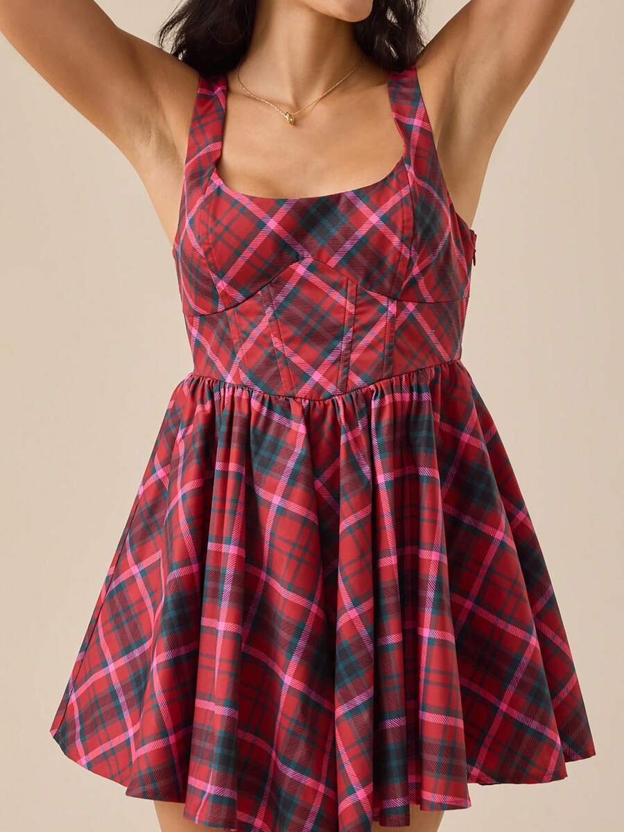 Elevate your seasonal wardrobe with this charming mini plaid dress. Featuring delicate spaghetti straps and a sleeveless silhouette, it's perfect for warm weather styling. The A-line cut flatters your figure while the pleated hem adds playful movement. Crafted from lightweight, breathable 100% polyester with high stretch fabric, this dress moves with you throughout your day. The bow back detail and natural waistline create an effortlessly cute look ideal for casual outings, dates, or everyday wear. Comforta