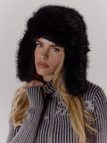 Side view of brown shaggy faux fur winter hat with full ear coverage
