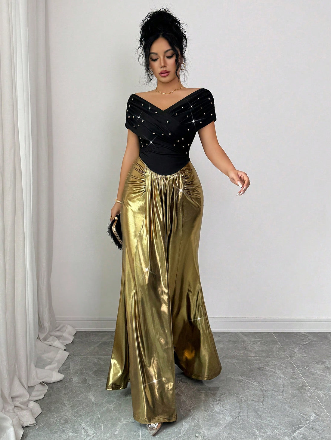 Make a grand entrance in this stunning off-shoulder fishtail gown that's pure elegance with a touch of fun! Delicate pearl embellishments cascade across the bodice, catching light with every graceful movement. The dramatic fishtail silhouette hugs your curves before flowing into a show-stopping train, perfect for weddings, galas, and those unforgettable formal moments. Whether you're walking down the aisle or dancing the night away, this gown transforms you into the star of the evening. Timeless sophisticat