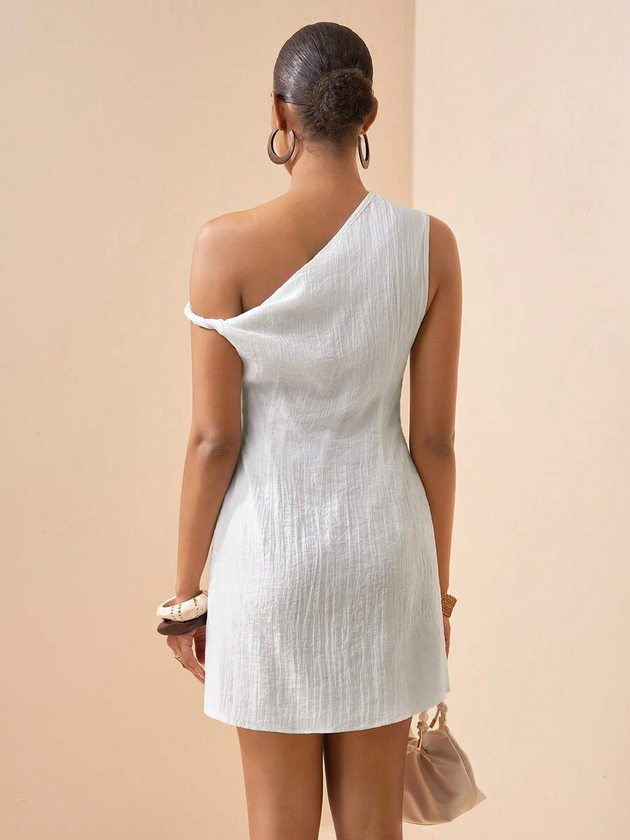 Elevate your spring and summer wardrobe with this stunning white off-shoulder dress. Featuring an asymmetrical neckline and ruched detailing, this sleeveless mini dress offers a sophisticated silhouette perfect for parties, graduations, and getaways. The fitted bodycon design is crafted from a luxurious blend of 80% lyocell and 20% polyamide for a smooth, elegant drape. A convenient zipper closure and lined interior ensure comfort and ease. The semi-sheer woven fabric adds an ethereal touch to this timeless