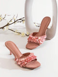 Front product view of coral pink square-toe mules with iridescent paillette strap details