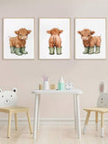 Three cute cow prints in light wood frames for kids room