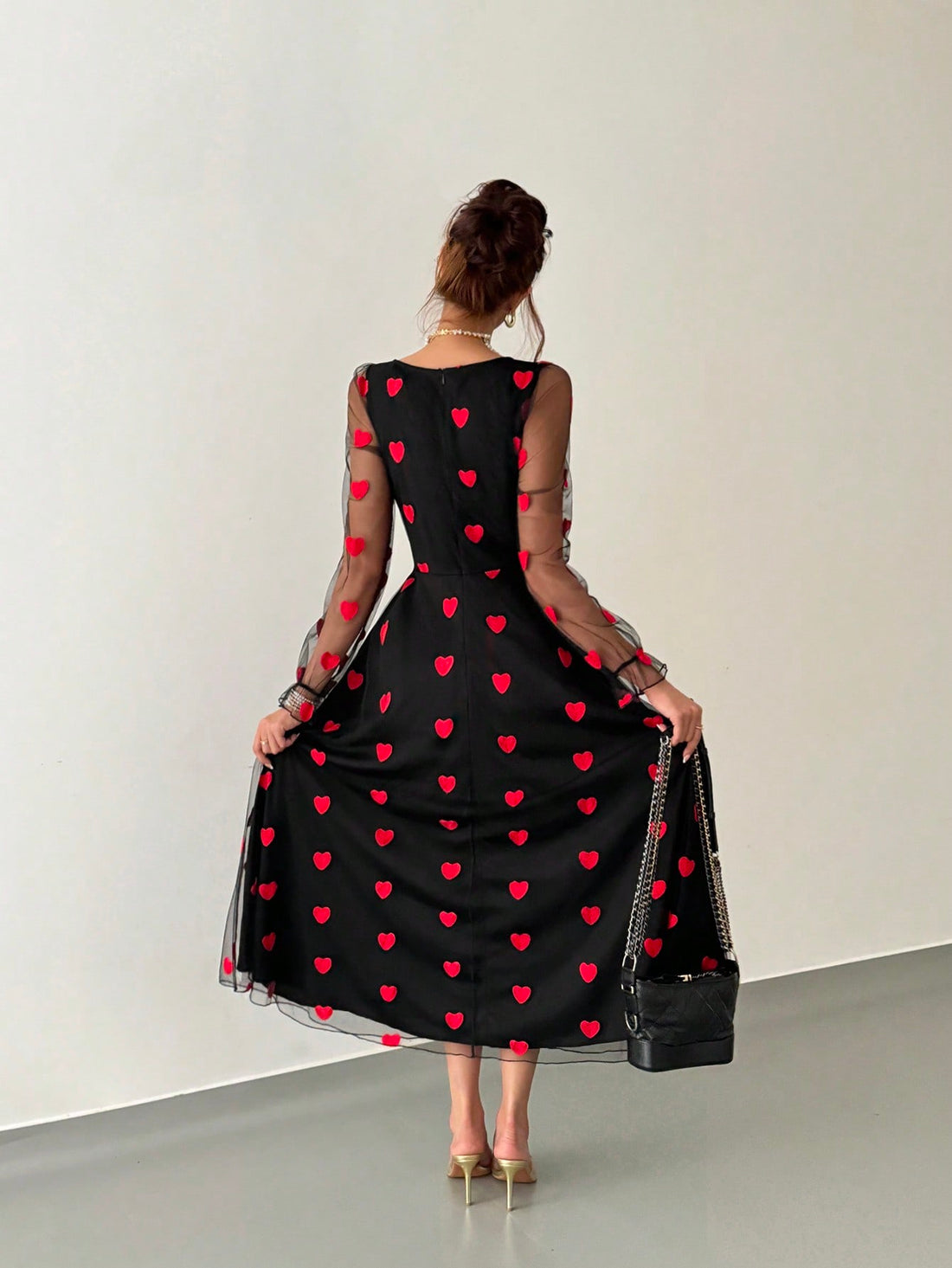 Elevate your wardrobe with this striking red mesh dress, designed to make a sophisticated statement. The heart-shaped silhouette flatters your figure while the distinctive lotus leaf sleeves add an artistic, fashion-forward touch. Crafted from quality mesh fabric, this piece transitions seamlessly from romantic evenings to elevated everyday styling. The thoughtful design balances elegance with modern flair, making it a versatile addition to any collection. Perfect for those who appreciate distinctive detail