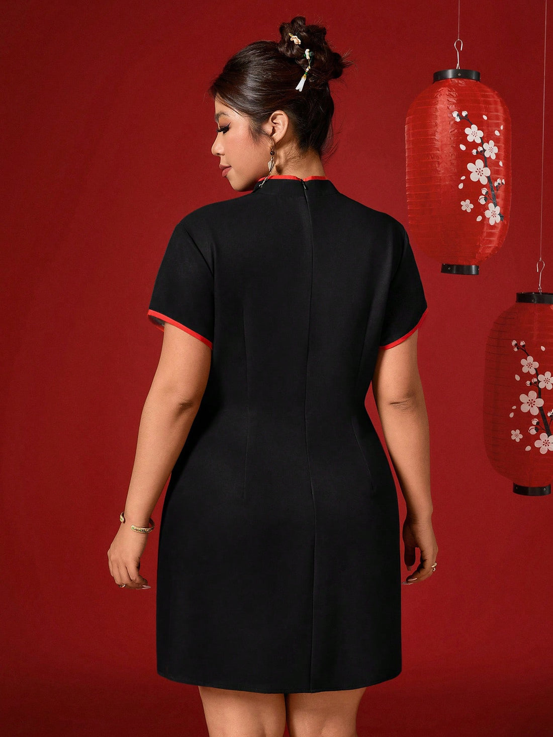 Ring in the new year with confidence in this striking plus-size dress! Featuring a bold graphic print against a sleek black backdrop, it's the perfect blend of elegance and edge. The crisp stand collar adds a touch of sophistication, while short sleeves keep things comfortable and chic. Whether you're celebrating at a holiday gathering or stepping into 2026 with style, this dress delivers instant glamour without compromising on comfort. Make a statement that's unmistakably you.