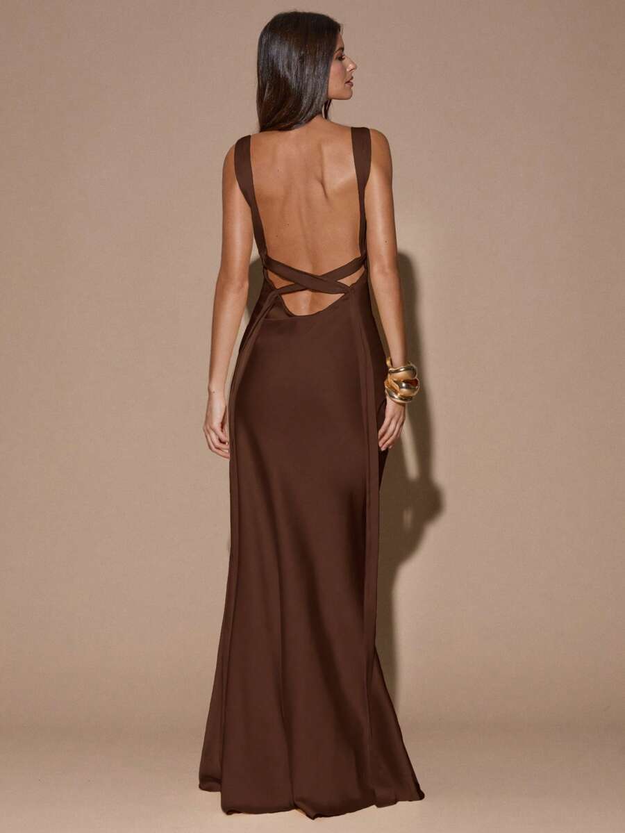 Close-up back view of ivory sleeveless deep V-neck maxi dress with crossed open back, shown for wedding and evening wear