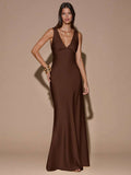 Front view of dark brown sleeveless deep V-neck maxi dress with crossed open back, shown for wedding and evening wear