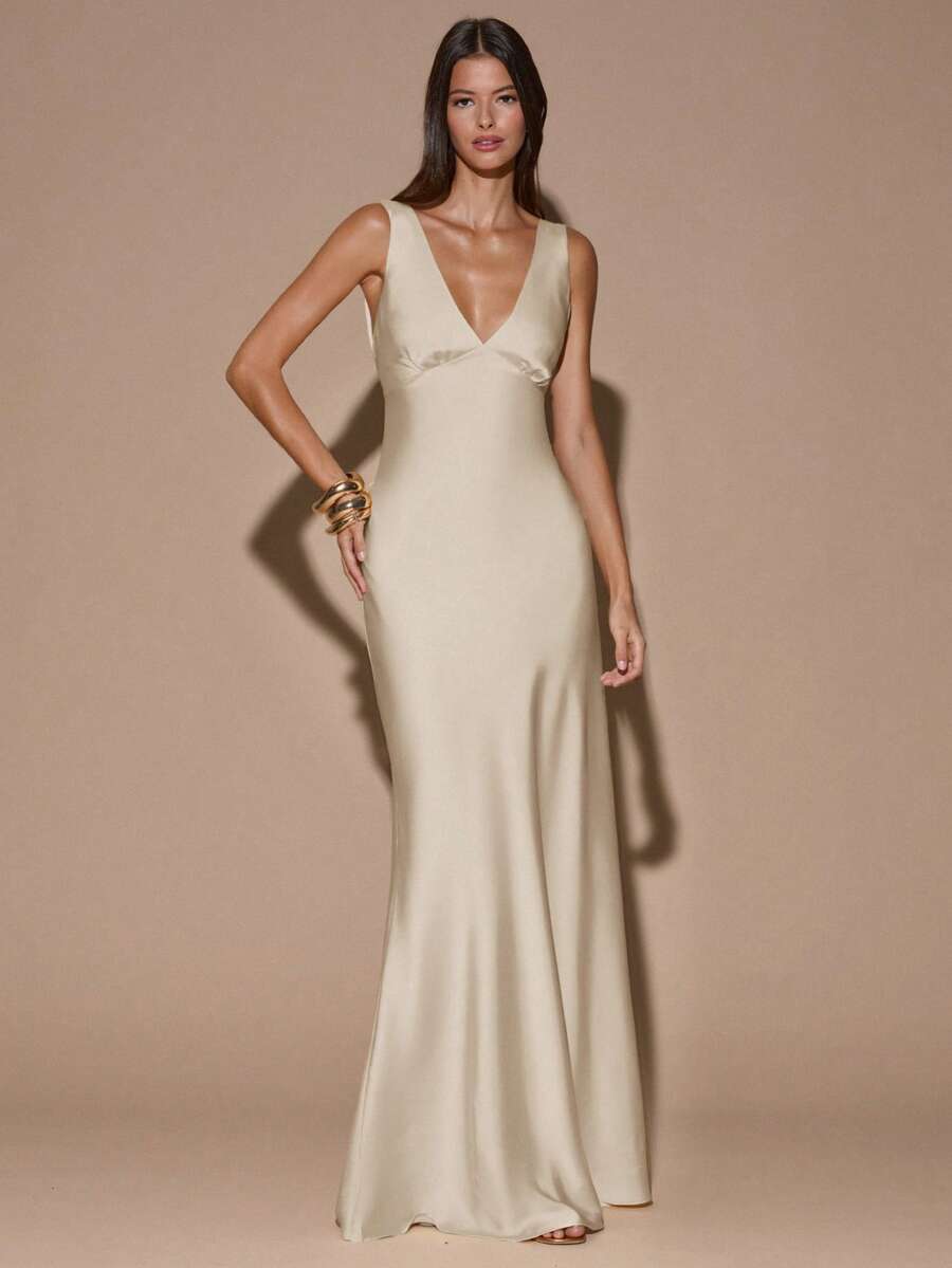 Front view of ivory sleeveless deep V-neck maxi dress with crossed open back, shown for wedding and evening wear