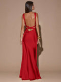 Back view of purple sleeveless deep V-neck maxi dress with crossed open back, shown for wedding and evening wear