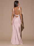 Back view of ivory with black polka dots sleeveless deep V-neck maxi dress with crossed open back, shown for wedding and evening wear