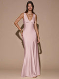 Front view of ivory with black polka dots sleeveless deep V-neck maxi dress with crossed open back, shown for wedding and evening wear