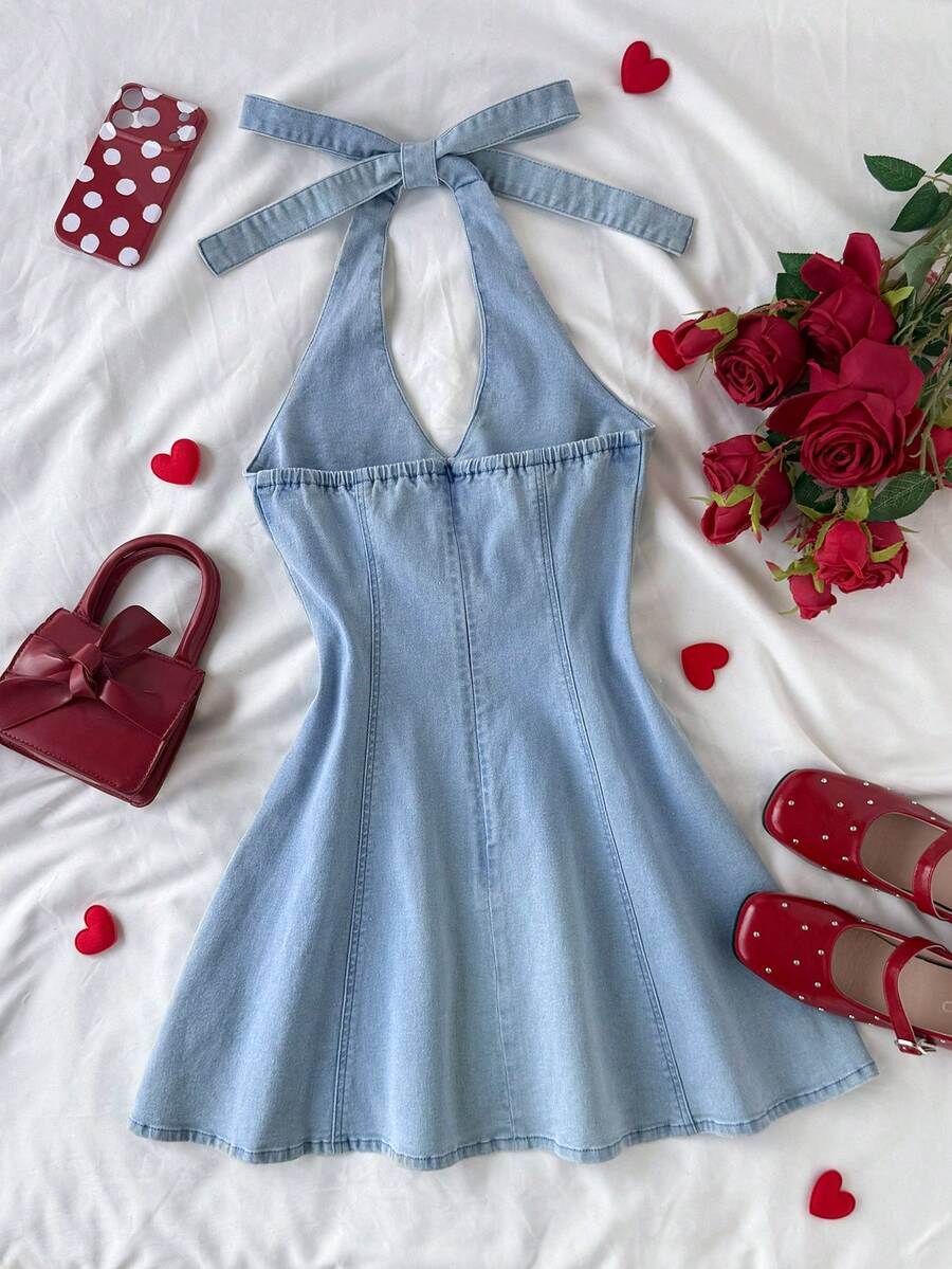 Elevate your wardrobe with this chic halter neck denim mini dress. The flattering halter design creates a sophisticated silhouette while the classic denim fabric offers timeless style and durability. Perfect for Valentine's Day dates, summer outings, or casual weekend adventures, this versatile piece transitions effortlessly from day to night. The mini length showcases your legs while maintaining an elegant aesthetic. 