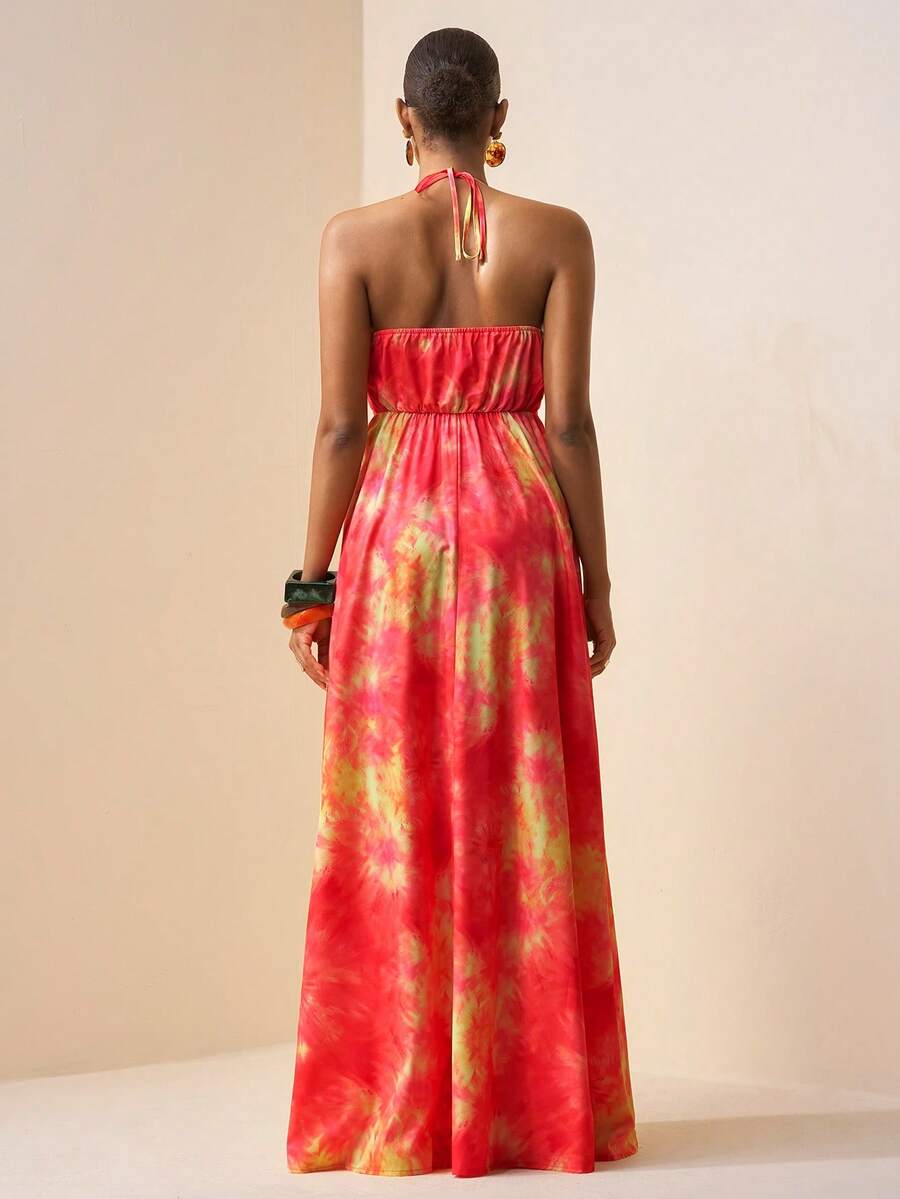 Embrace effortless bohemian style with this stunning tie-dye floral maxi dress. Featuring delicate spaghetti straps, a flattering high waist, and a daring backless design with thigh split, this piece transitions seamlessly from festival grounds to beach getaways. The semi-sheer woven fabric in soft pink tones drapes beautifully in a flared silhouette, while the slim fit keeps you feeling confident and comfortable. Perfect for creating those carefree, wanderlust-inspired looks all season long.