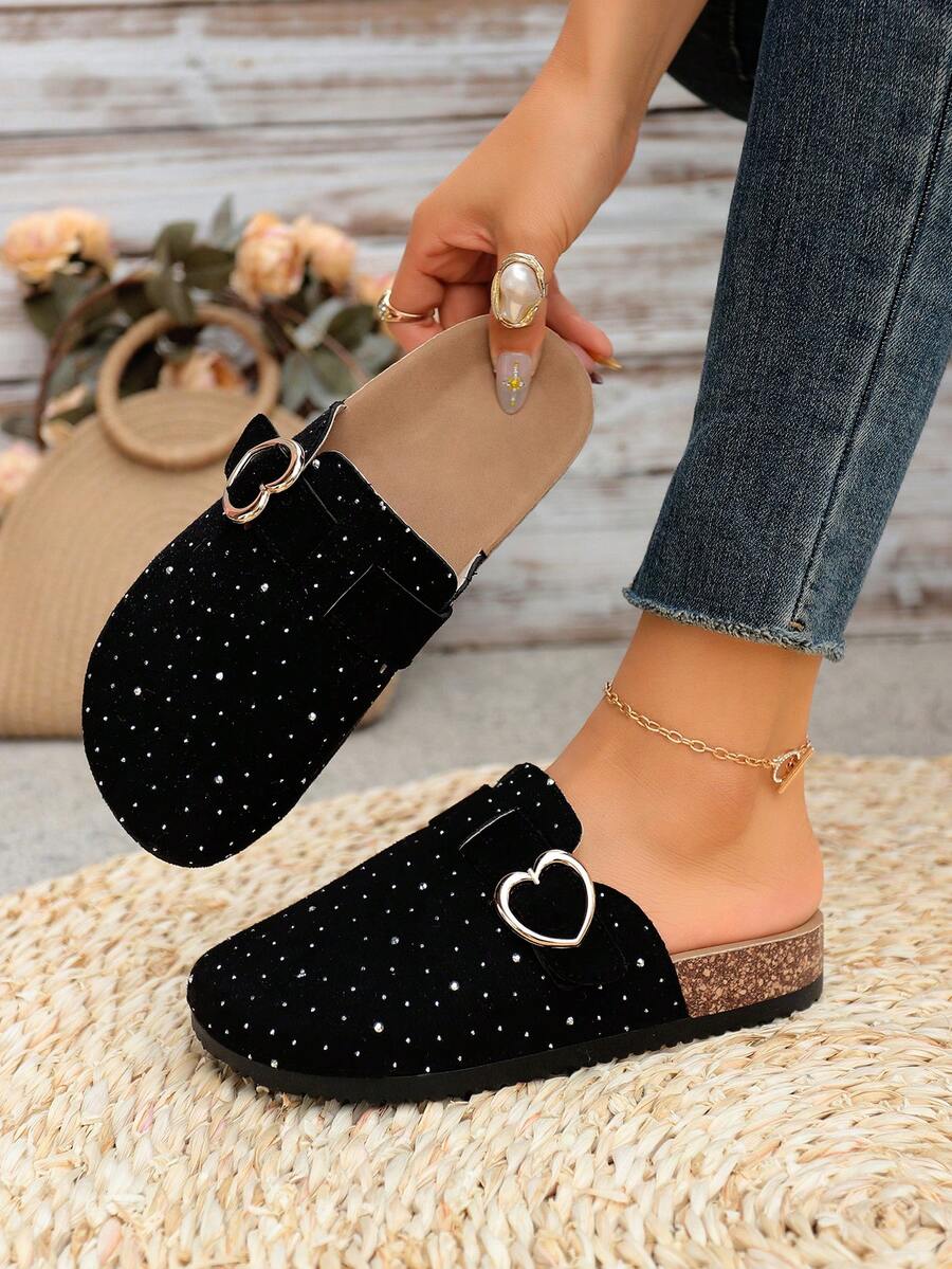 Step into effortless elegance with these crystal heart-shaped mule slippers, designed for women who value both style and comfort. Featuring a lightweight construction and supportive thick sole, they're perfect for spring and summer lounging or casual indoor wear. The charming heart-shaped crystal embellishment adds a touch of sparkle to your everyday look, while the mule design offers easy slip-on convenience. Ideal for keeping your feet comfortable and fashionable throughout the warmer months.