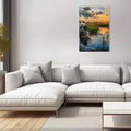 Vertical framed canvas with blue orange sunset and cow by water