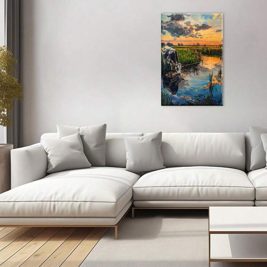 Vertical framed canvas with blue orange sunset and cow by water