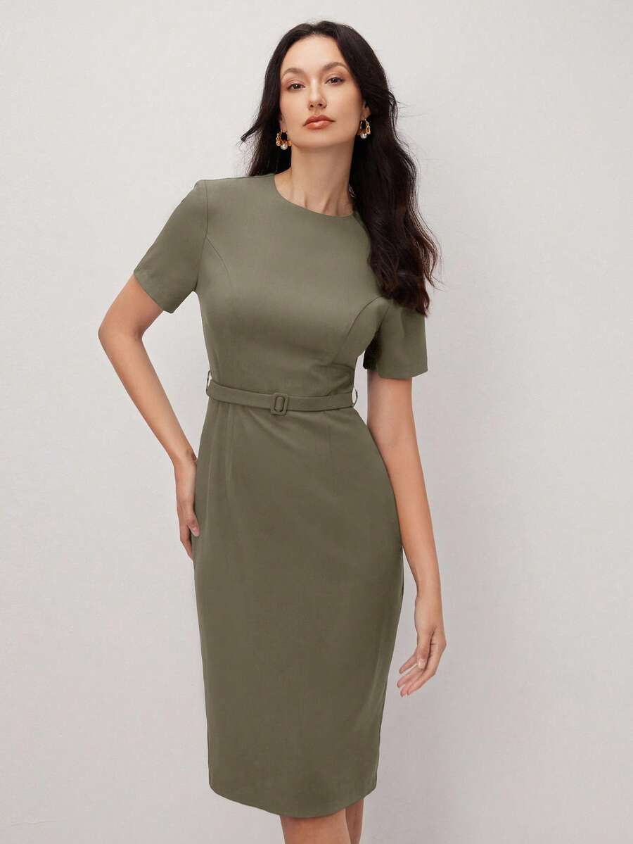 Effortless elegance meets everyday versatility in this stunning pullover dress. The classic round neckline and sleek black silhouette create a timeless foundation, while the apricot accent details add a subtle pop of warmth and sophistication. The included belt cinches at the waist for a flattering, defined shape that transitions seamlessly from the office to weekend outings. Crafted for comfort and style, this dress works beautifully for professional settings, casual gatherings, and special occasions. 