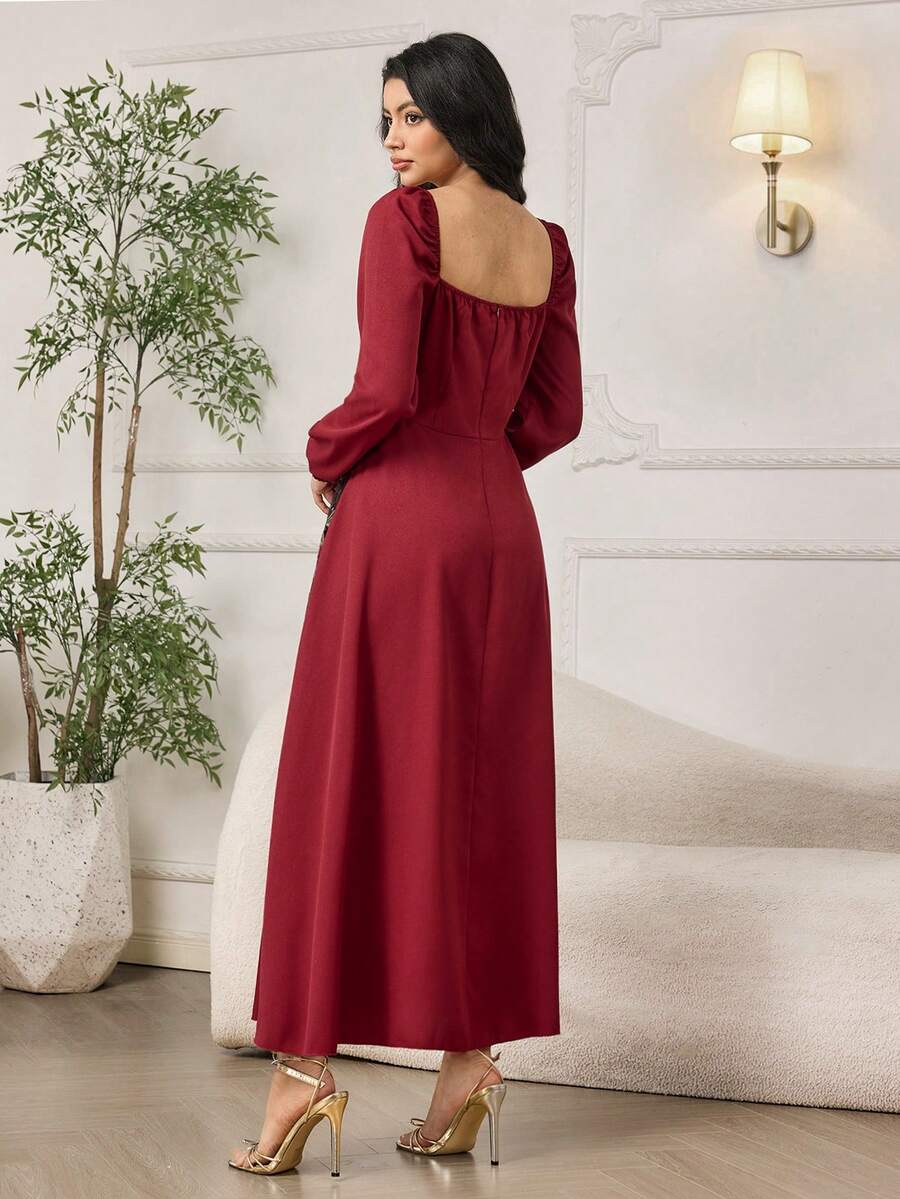 Back view of burgundy long sleeve maxi dress with square open-back neckline and zipper