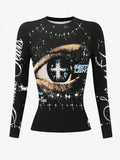 Front product view of black crew-neck top with eye, cross, script, and paint graphics