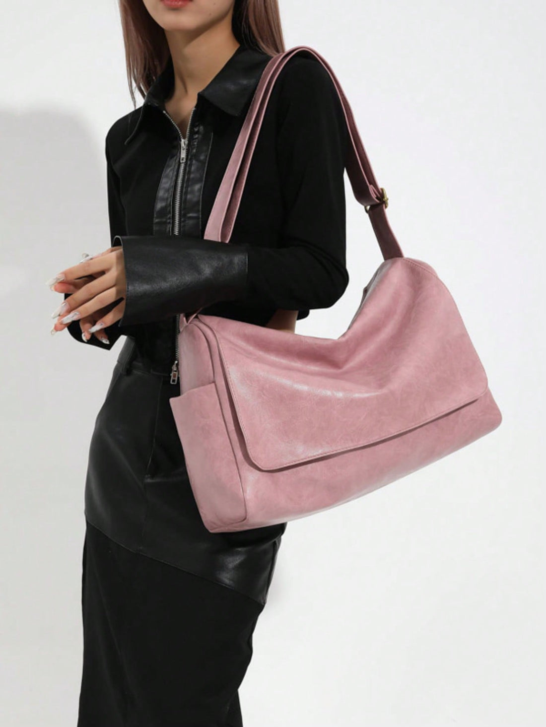 Crafted from supple leather in a timeless pink hue, this crossbody bag seamlessly transitions from day to evening. The generous interior accommodates daily essentials while the adjustable strap allows hands-free carrying at your preferred length. Vintage-inspired detailing adds character without compromising modern functionality. Whether running errands or meeting friends, this shoulder bag delivers both style and practicality in one versatile piece.