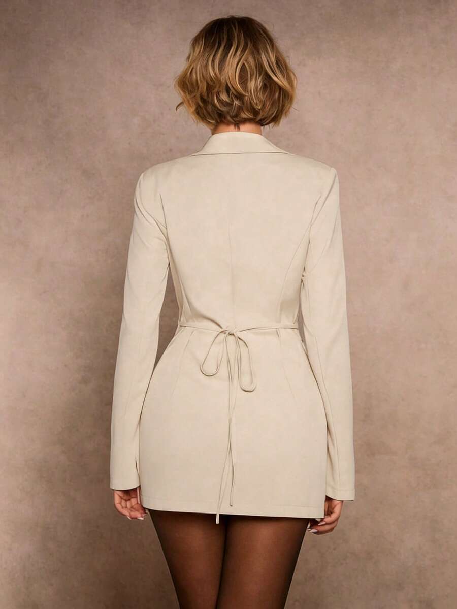 tailored blazer mini dress in burgundy, black and cream with deep V notched lapels, long sleeves, structured shoulders, three gold buttons, cinched waist, back tie, front draped mini skirt and side ruching slit image 8